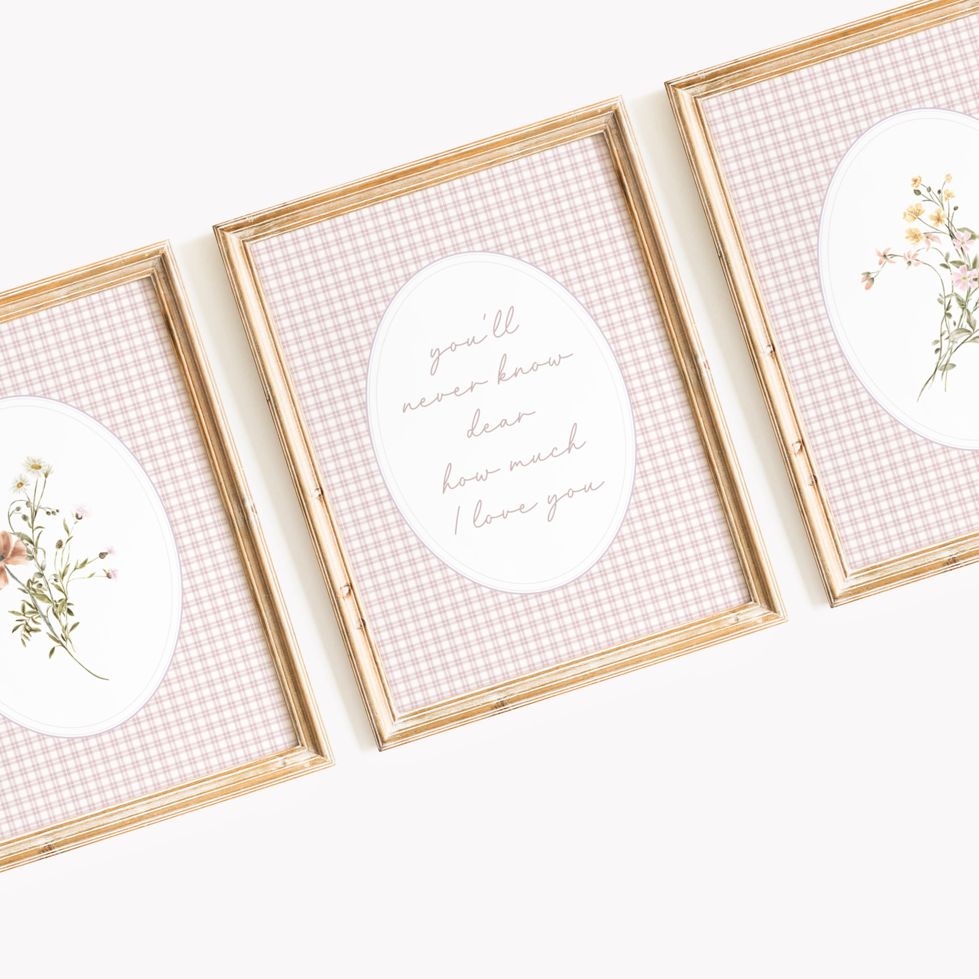 Three framed prints with floral designs and text on a light background