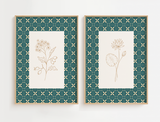 Two framed botanical prints with decorative green frames on a white background