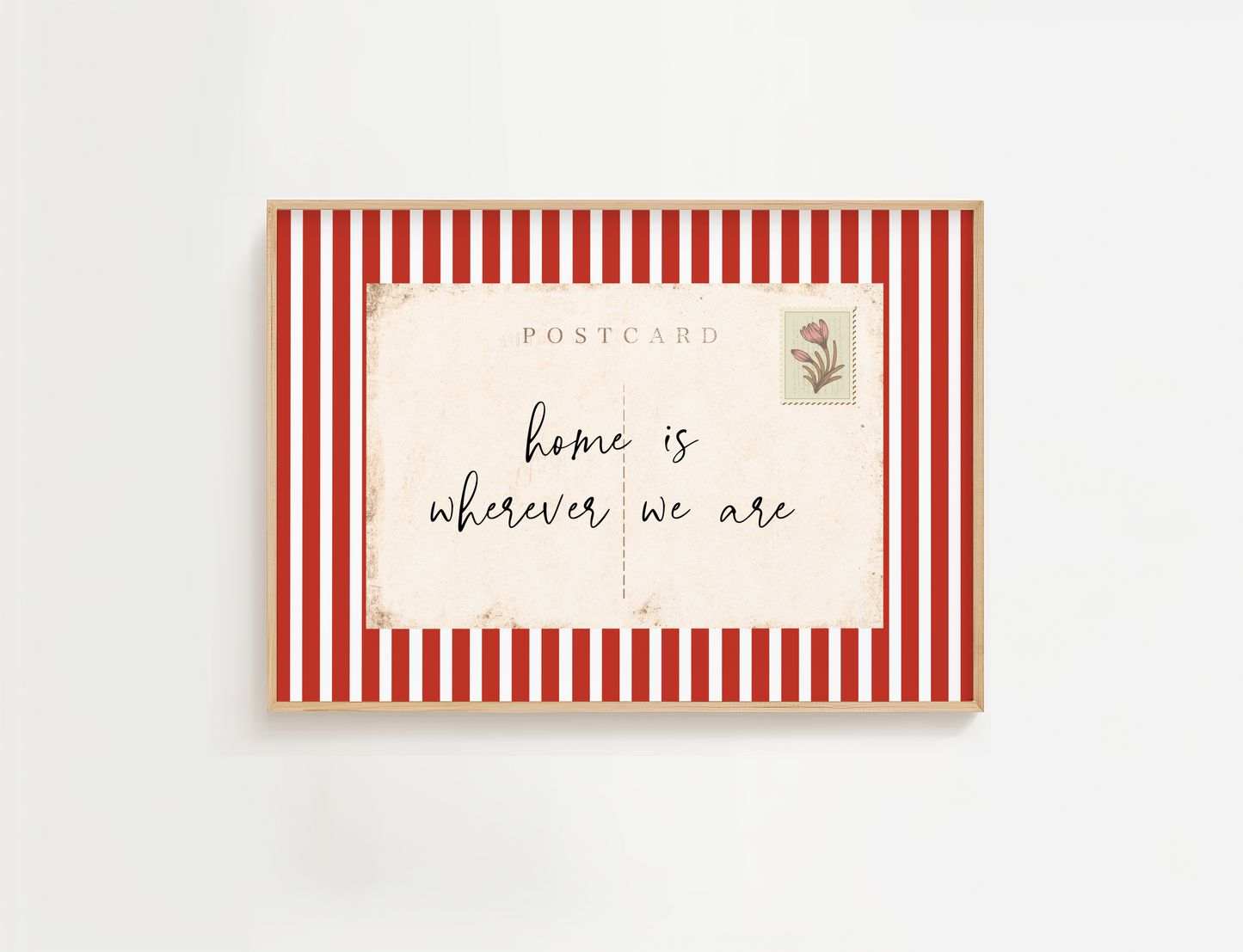 Framed postcard with red and white striped border and 'home is wherever we are' text.