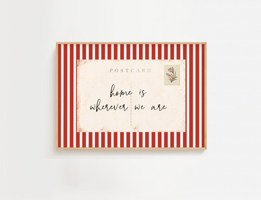 Framed postcard with red and white striped border and 'home is wherever we are' text.