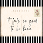 Postcard with 'it feels so good to be home' text on a black and white striped background