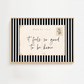 Framed postcard with 'it feels so good to be home' text on a white background