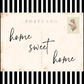 Postcard with 'home sweet home' text on a black and white striped background