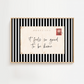 Framed black and white striped art print with a postcard message on a white background