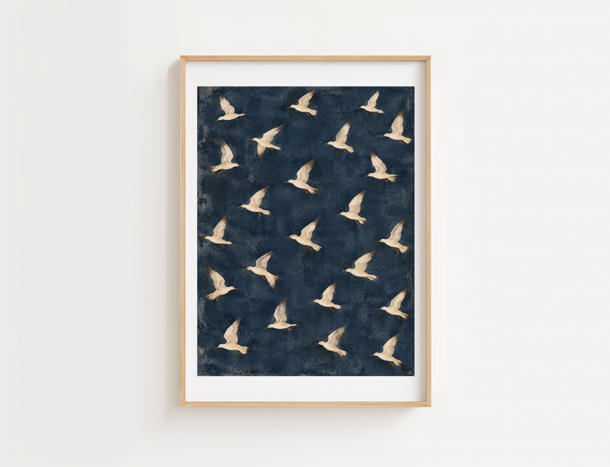 Coastal bird artwork in a natural wood frame.