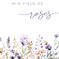A white square design with the text 'IN A FIELD of roses' at the top and a watercolor border of pastel flowers and butterflies along the bottom.