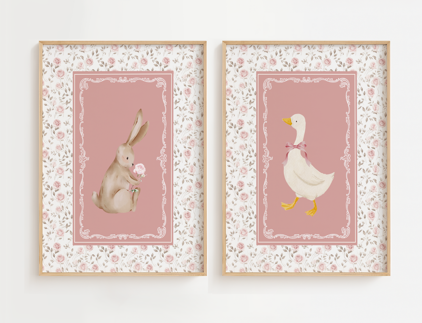 Nursery wall art featuring a vintage goose and bunny framed with a cottagecore nursery design of delicate pink and sage flowers. Girl nursery wall decor set.