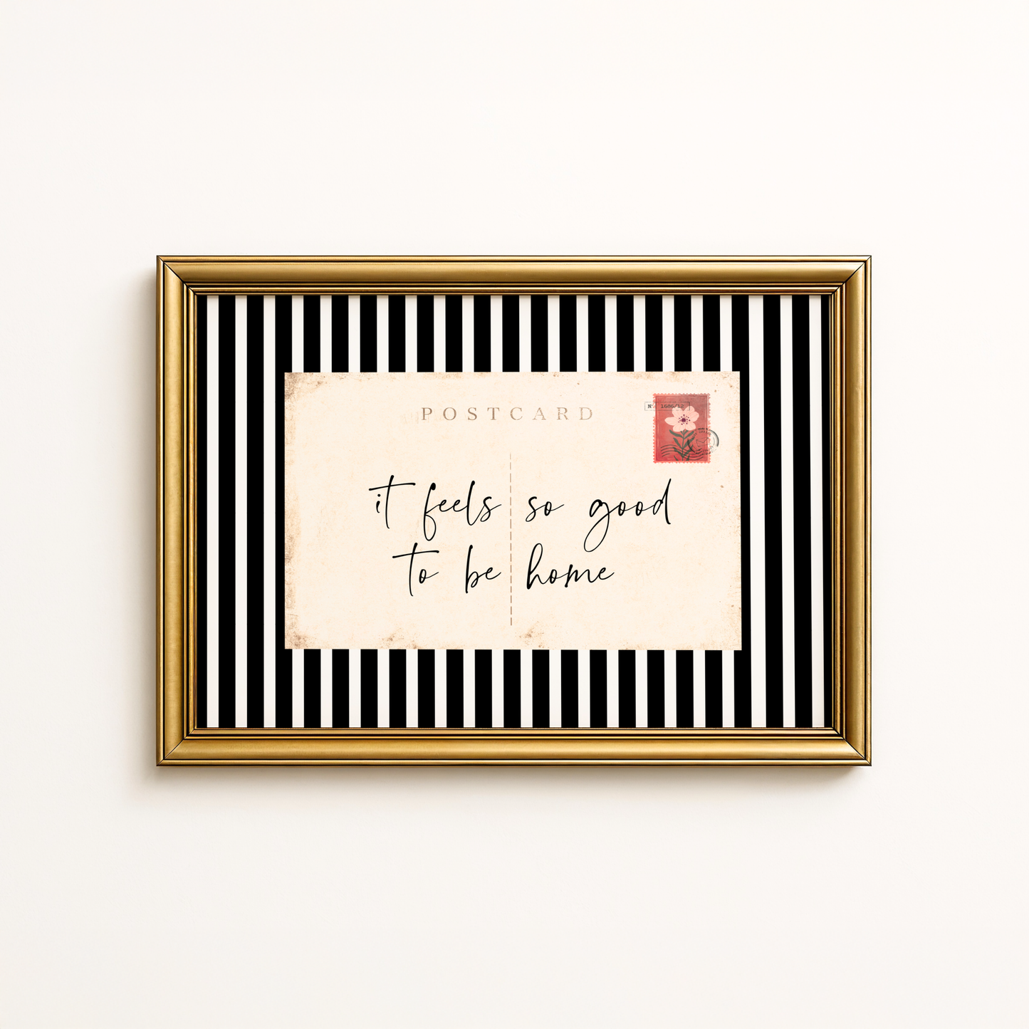 Entry way wall art featuring black and white stripes and a quote, It Feels so good to be home. Entry way welcome sign.
