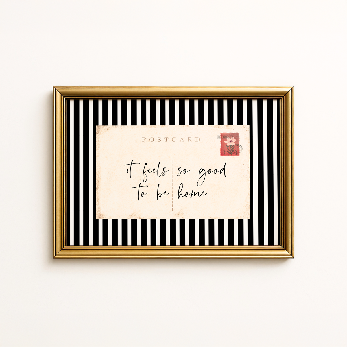 Entry way wall art featuring black and white stripes and a quote, It Feels so good to be home. Entry way welcome sign.