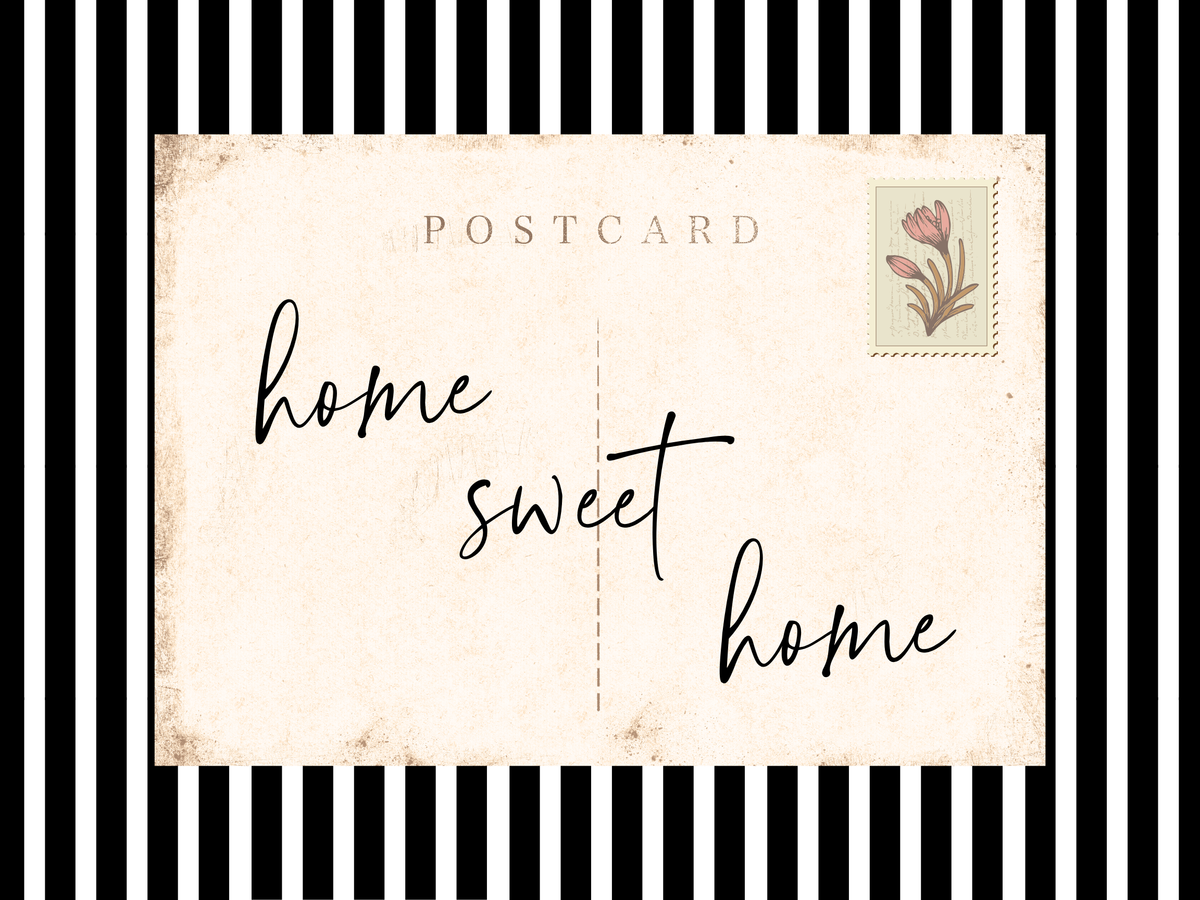 Entry way wall art featuring black and white stripes and a quote, Home Sweet Home. Entry way welcome sign.