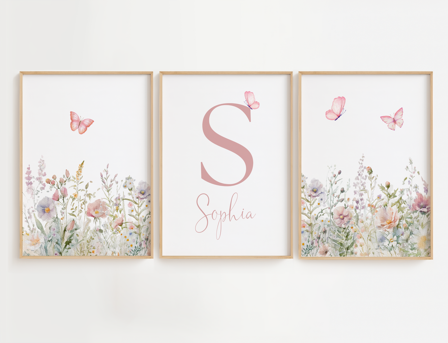 Floral nursery wall art with butterflies featuring a set of 3 prints with sage and pink flowers and a name sign for girl nursery decor.