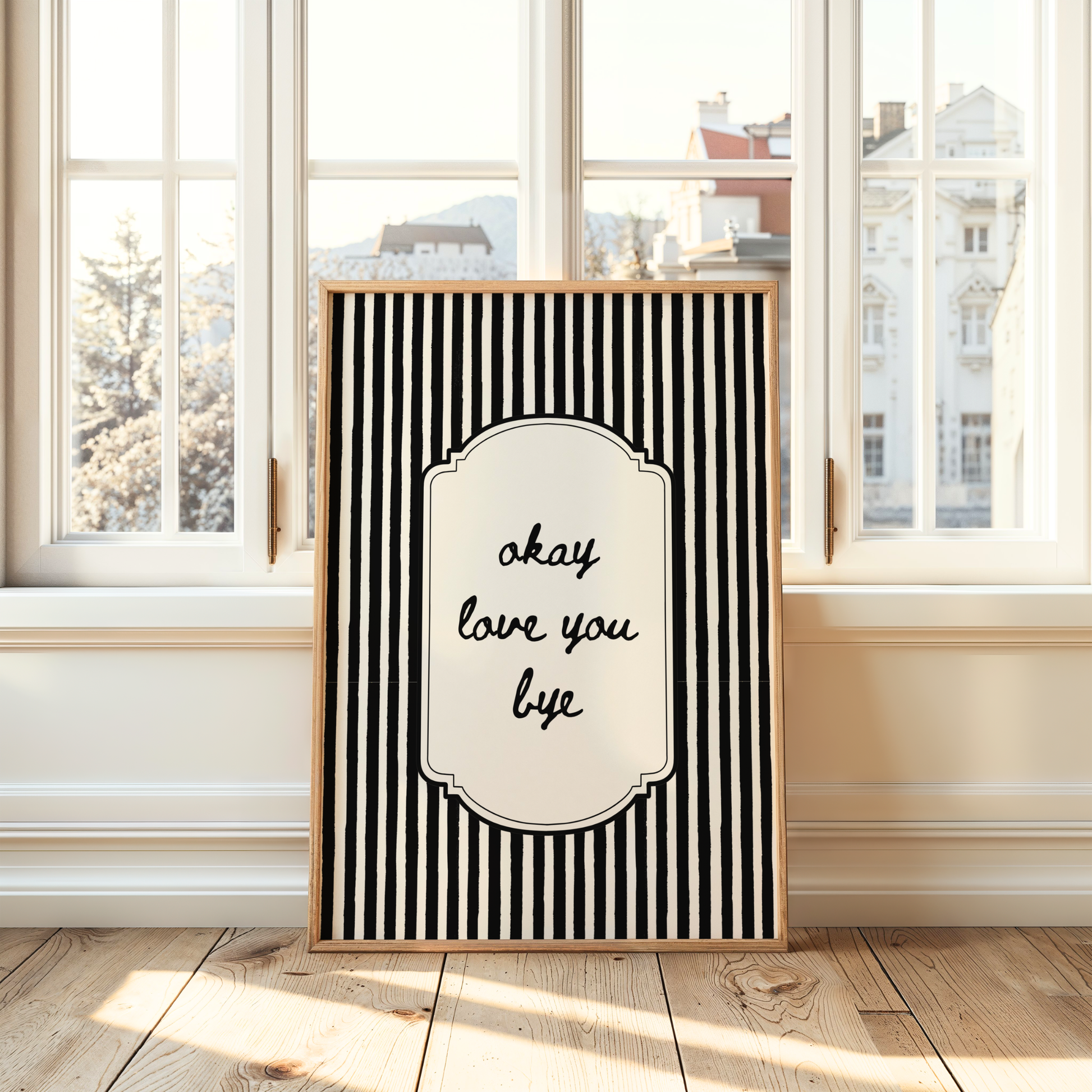 Modern wall art featuring framed artwork with black and white stripes and the quote, Okay Love You Bye. Home wall art.