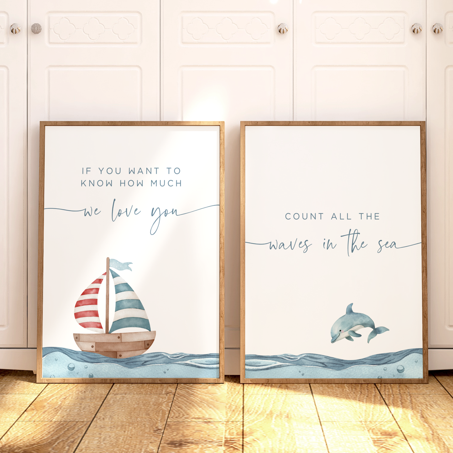 Nautical nursery wall art featuring a blue, red and white sailboat on the ocean. Boy nursery wall art for baby boy room.