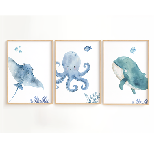 Ocean nursery wall art featuring octopus, what, and stingray in shades of blue. Ocean nursery wall decor set of 3 for baby boy room.