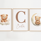Three framed prints with teddy bears on clouds and a moon, and the name 'Carter'.