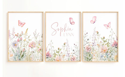 Floral nursery wall art with butterflies featuring a set of 3 prints with sage and pink flowers and a name sign for girl nursery decor.