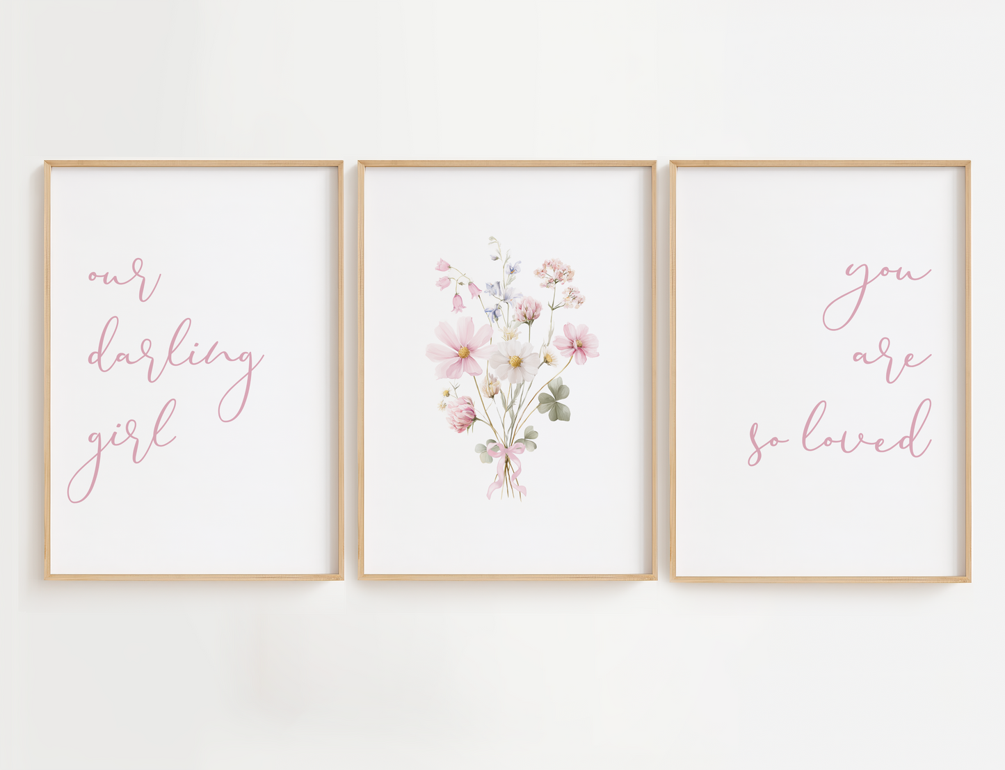 Three framed prints with floral and text design on a white wall.