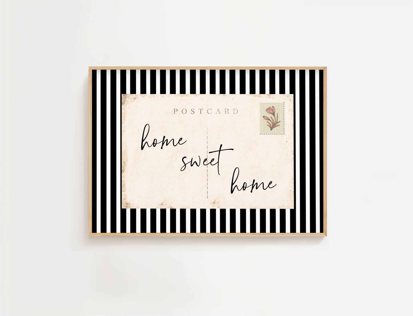 Framed postcard with 'home sweet home' text on a white background