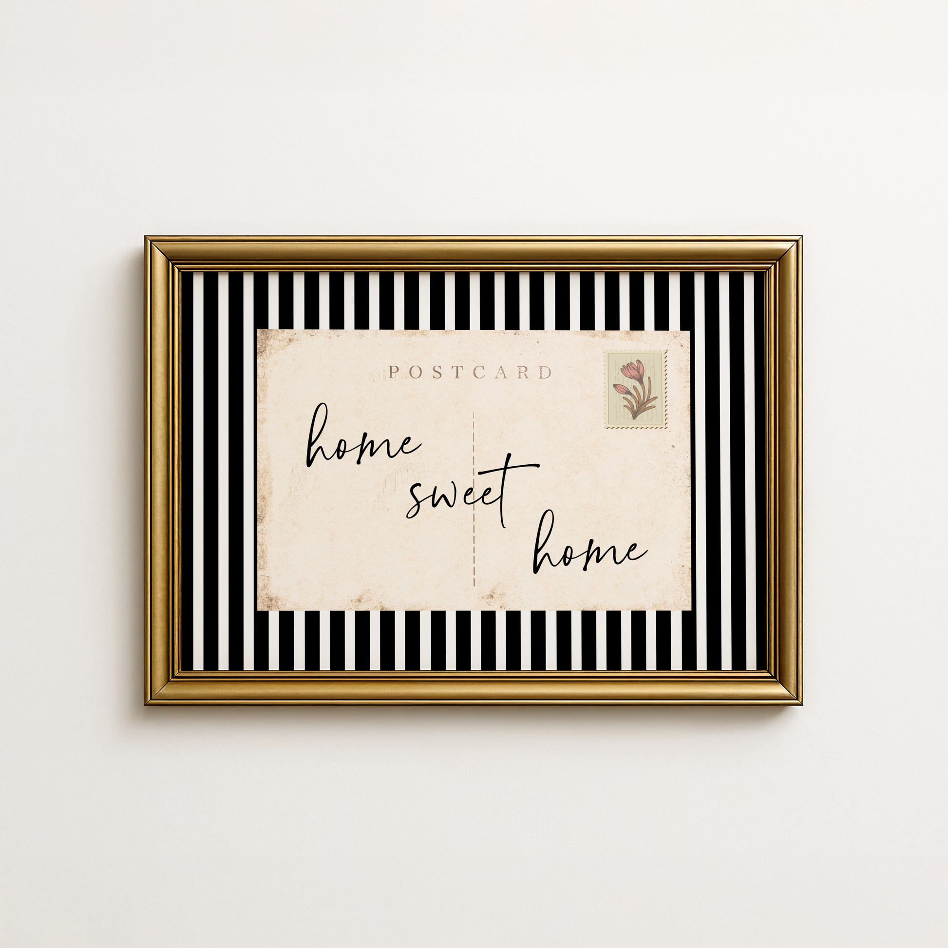 Framed artwork with 'home sweet home' text on a striped background