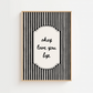 Framed black and white striped artwork with 'okay love you bye' text on a white background