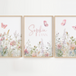 Three framed prints with floral designs and butterfly illustrations on a white background.