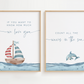 Two framed prints with a sailboat and dolphin design on a light background