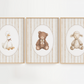 Three framed illustrations of a duck, bear, and sheep on a white wall.