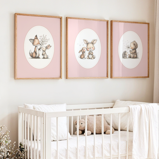 Nursery room with framed illustrations of animals above a crib.