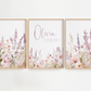 Three framed floral prints with a central name 'Olivia Leigh' on a white background