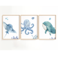 Three framed watercolor-style nursery wall art prints showing an octopus, a whale, and a ray on a white background, hung side by side on a light wall.