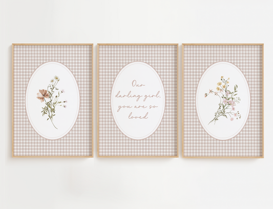 Three framed prints with floral designs and text on a white background