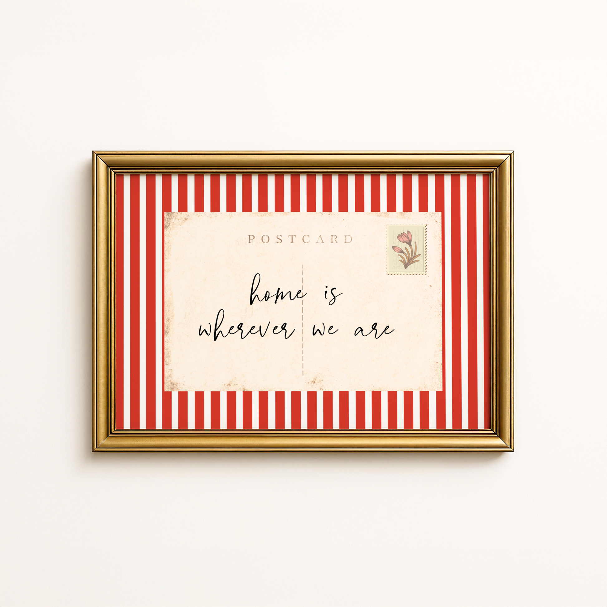 Framed postcard with red and white striped border and 'home is wherever we are' text.