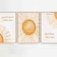 Three framed sun-themed nursery prints with motivational phrases on a white background