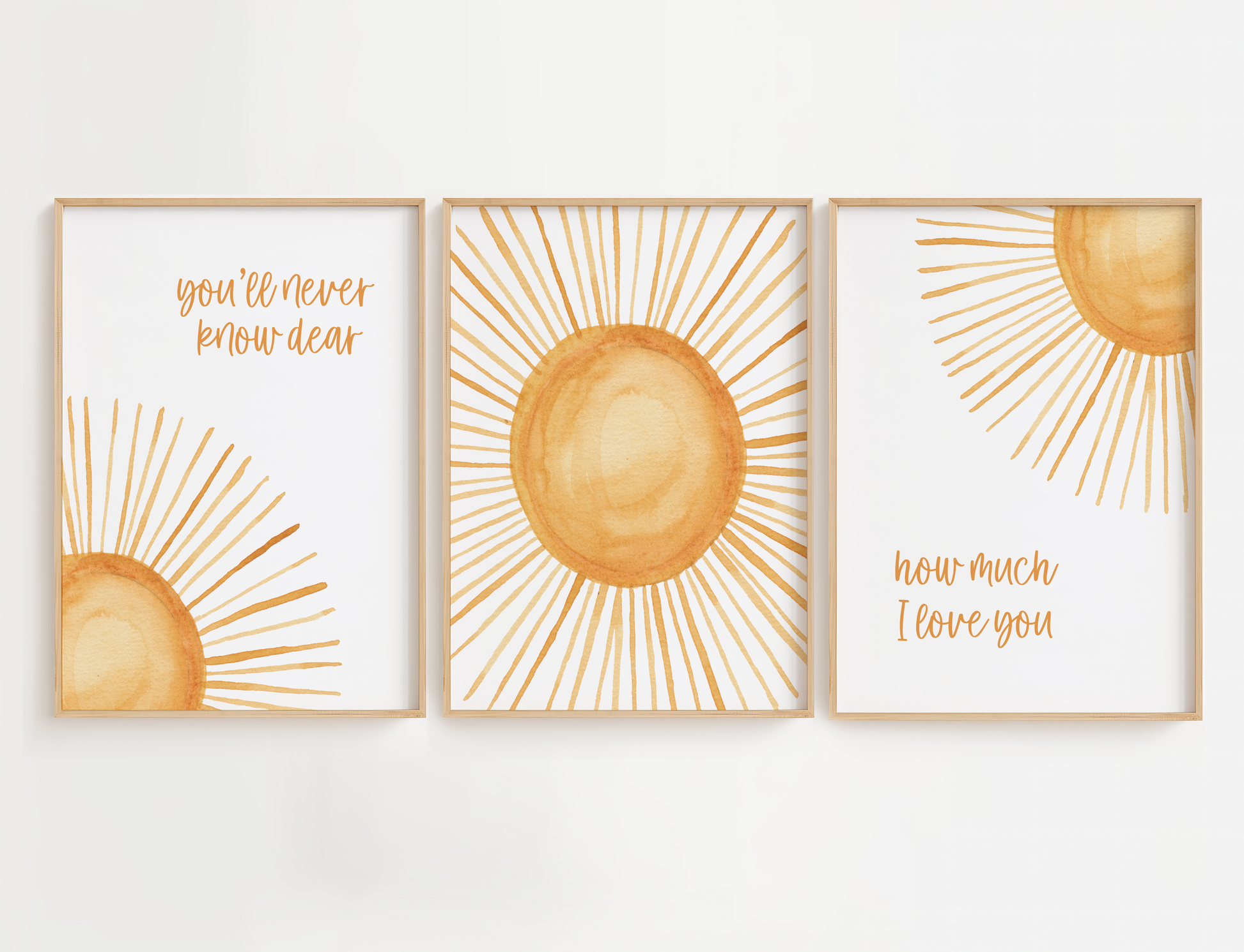Three framed sun-themed nursery prints with motivational phrases on a white background