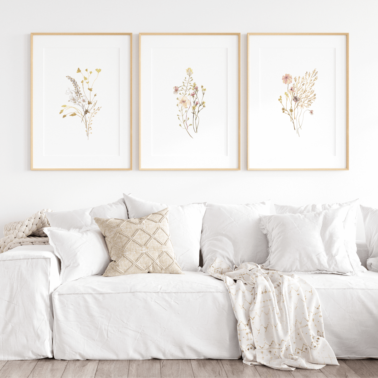 Flower wall art featuring delicate pink wildflowers in a set of 3 floral wall decor for above the couch or over the bed.