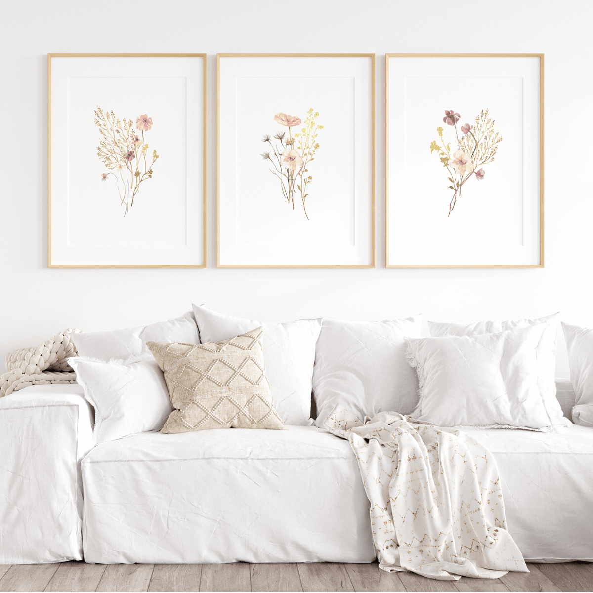 Flower wall art featuring delicate pink wildflowers in a set of 3 floral wall decor for above the couch or over the bed.
